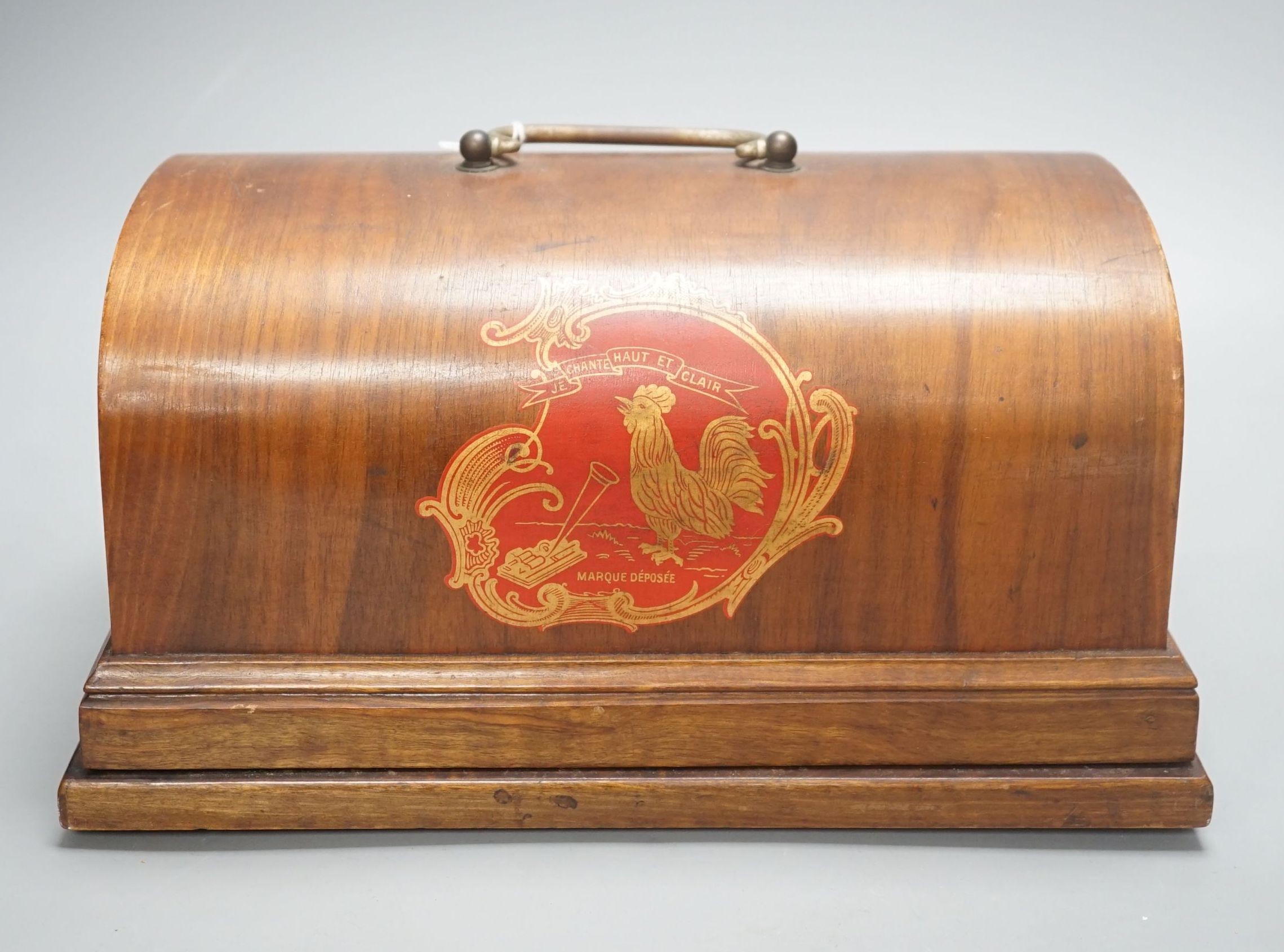 A Charles Pathé' cased phonograph, with separate aluminium horn, 30 cms wide.